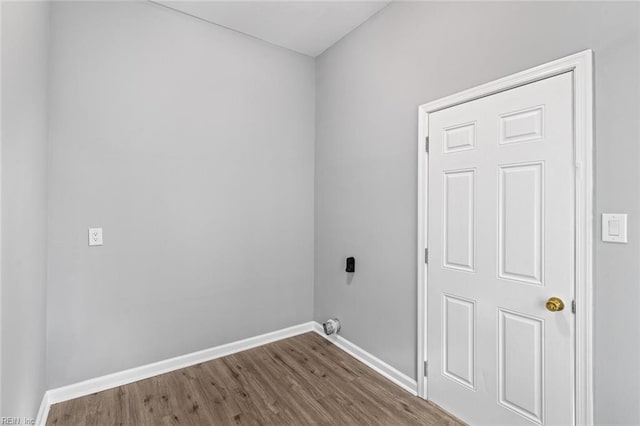 washroom with wood-type flooring