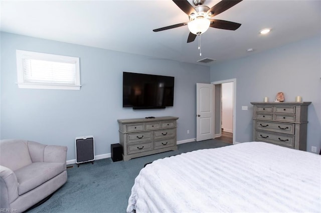 bedroom featuring ceiling fan and dark carpet