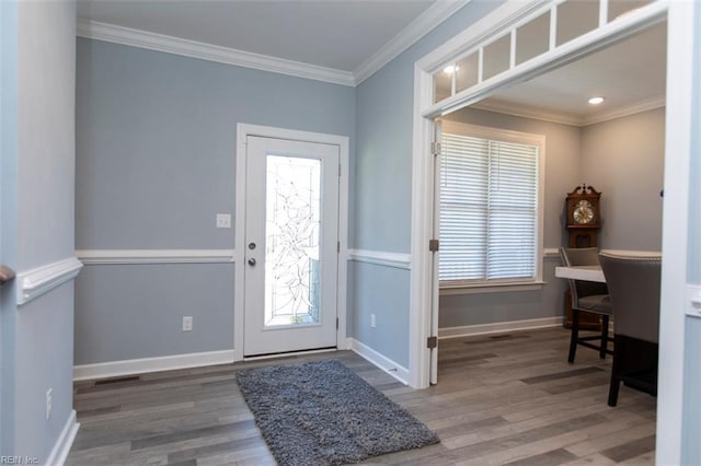 entrance foyer featuring hardwood / wood-style floors and crown molding