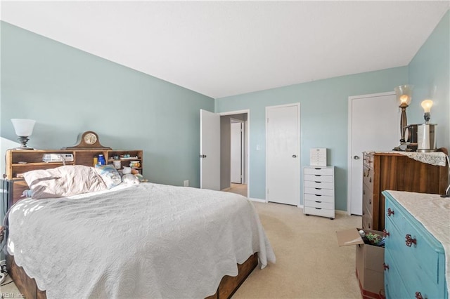 bedroom featuring light carpet