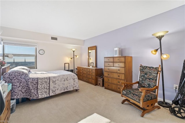 bedroom featuring light carpet