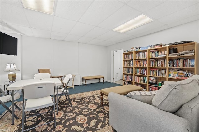 office space featuring a paneled ceiling and carpet