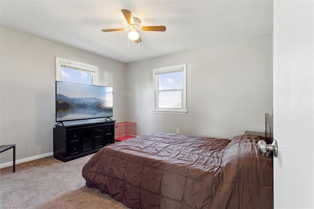 bedroom featuring light carpet and ceiling fan