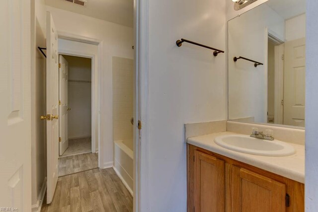 bathroom with wood-type flooring and vanity