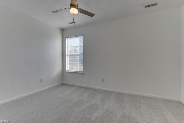 unfurnished room featuring ceiling fan and light colored carpet