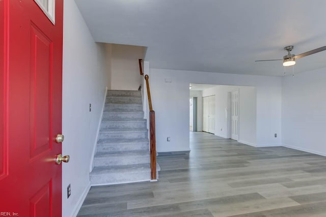 foyer with ceiling fan and light hardwood / wood-style flooring