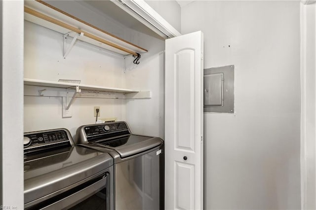 laundry room featuring electric panel and independent washer and dryer