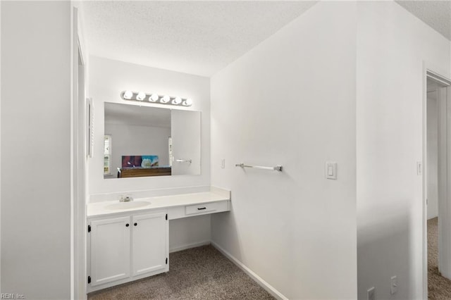 bathroom featuring vanity and a textured ceiling