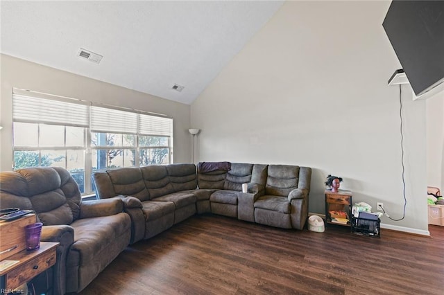 living room with vaulted ceiling and dark hardwood / wood-style floors