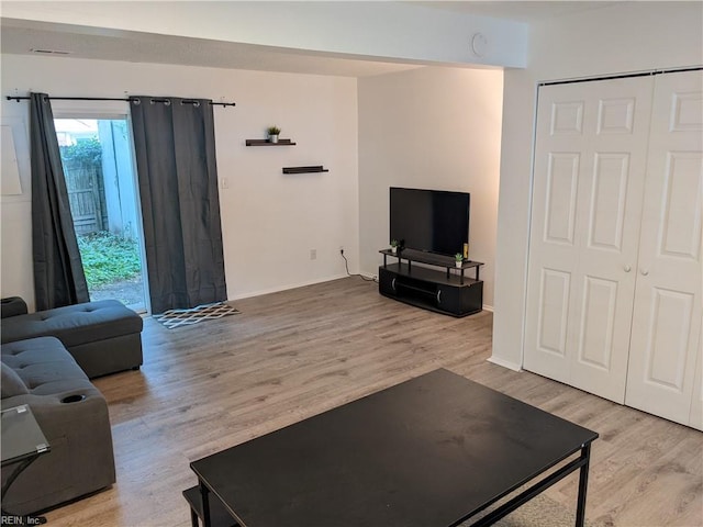 living room with light hardwood / wood-style flooring