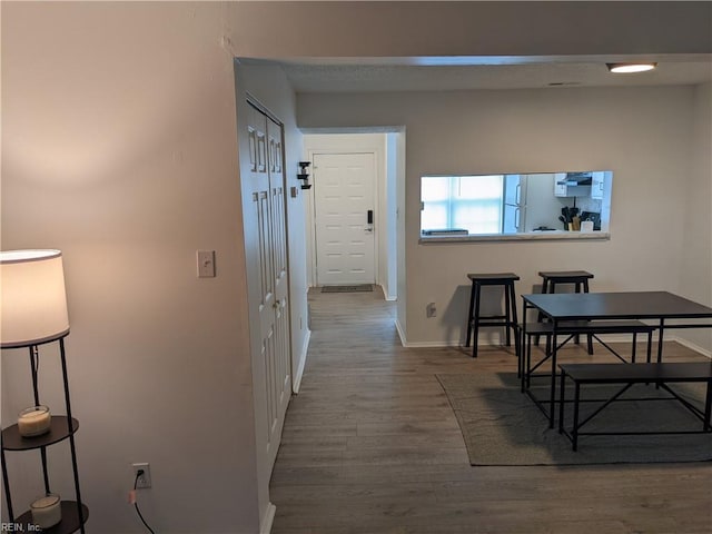 hallway featuring wood-type flooring