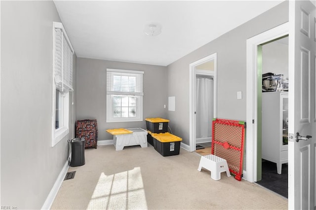 playroom featuring light colored carpet