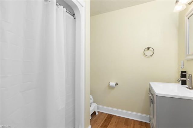 bathroom with hardwood / wood-style flooring and vanity