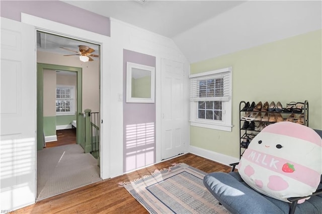 sitting room featuring lofted ceiling, hardwood / wood-style floors, and ceiling fan