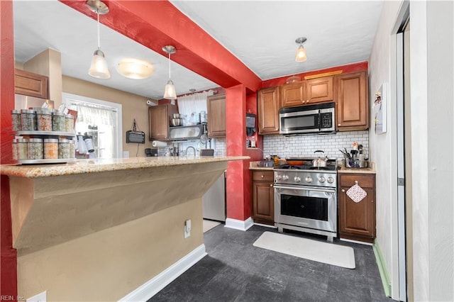 kitchen featuring stainless steel appliances, decorative backsplash, hanging light fixtures, and light stone countertops