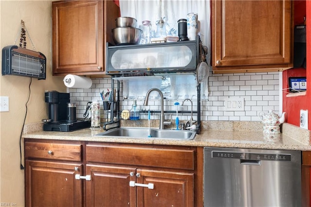 kitchen featuring a wall unit AC, dishwasher, backsplash, and sink