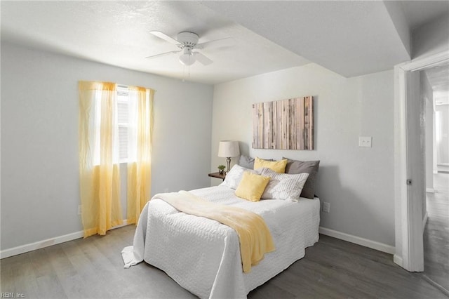 bedroom with hardwood / wood-style floors and ceiling fan