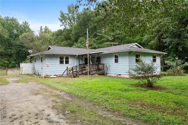 ranch-style house featuring a front lawn