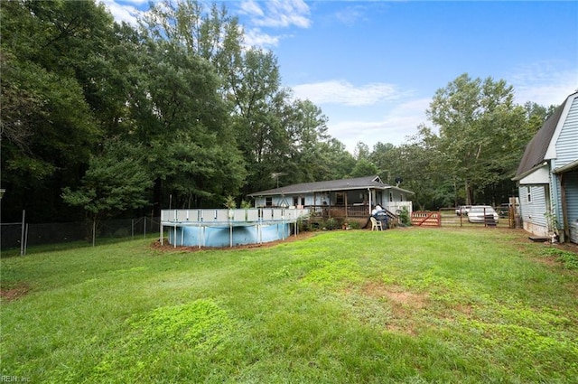 view of yard with a fenced in pool