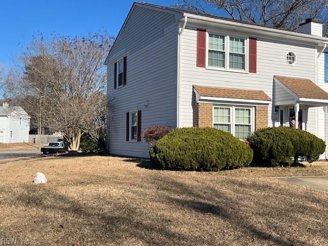 view of home's exterior featuring a lawn