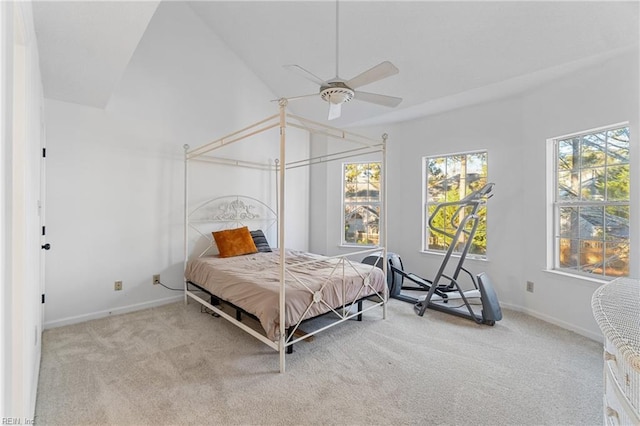 carpeted bedroom featuring ceiling fan and lofted ceiling