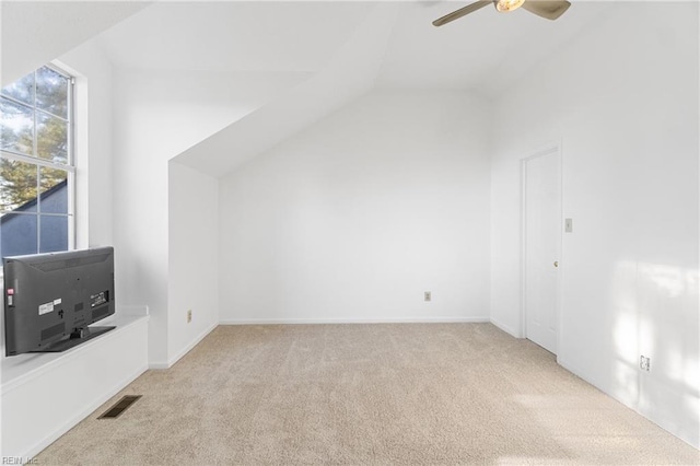 bonus room featuring ceiling fan, light colored carpet, and vaulted ceiling