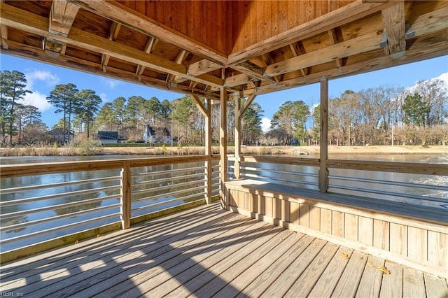 view of dock with a deck with water view