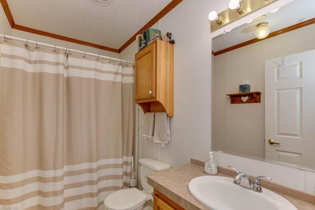 bathroom with toilet, walk in shower, vanity, ornamental molding, and a textured ceiling