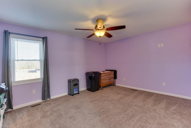 interior space with ceiling fan and carpet flooring