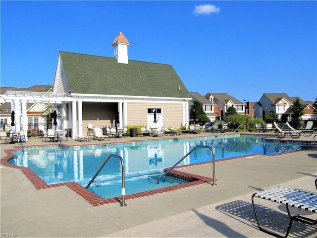 view of pool with a patio area and a pergola