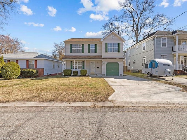 view of property with a front yard and a garage