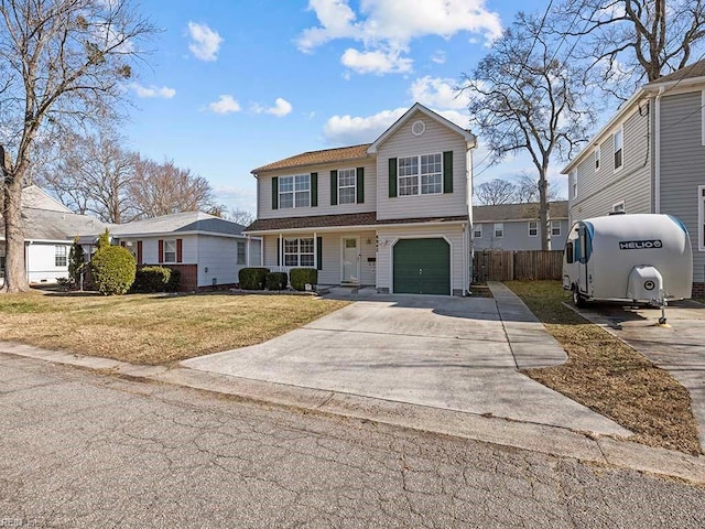 view of front facade with a front yard and a garage