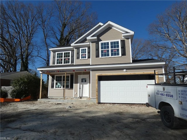 view of front of property with a garage and a porch