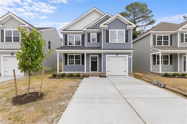 view of front of property featuring a porch, a front yard, and a garage