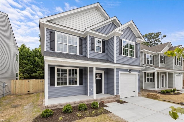 view of front of home with a porch and a garage