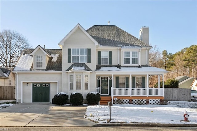 view of front facade featuring a garage and covered porch