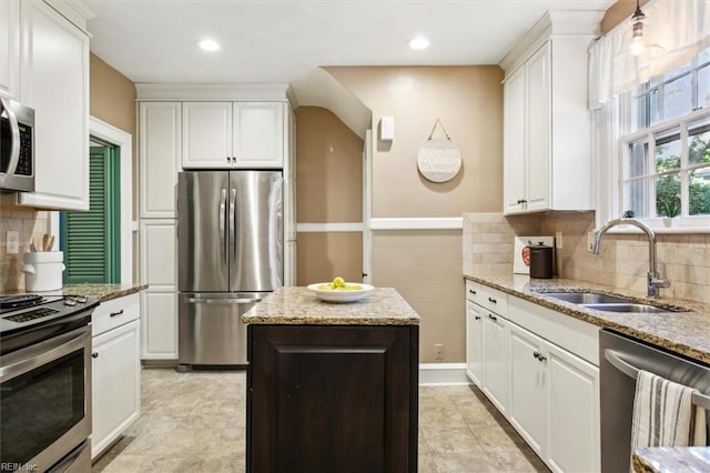 kitchen with sink, white cabinetry, and appliances with stainless steel finishes