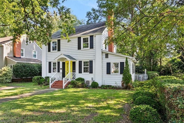 colonial inspired home with a front yard