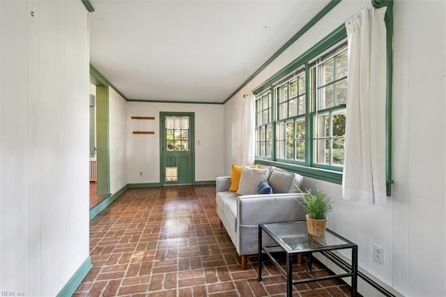 interior space with wood walls and crown molding