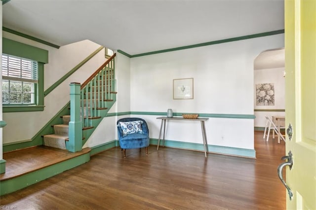 interior space with crown molding and hardwood / wood-style floors