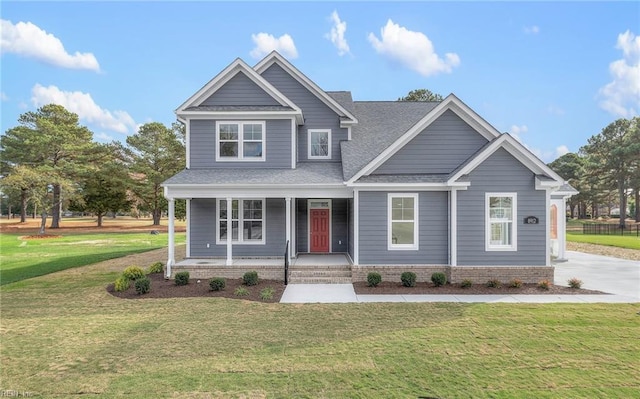 view of front facade featuring a porch and a front lawn