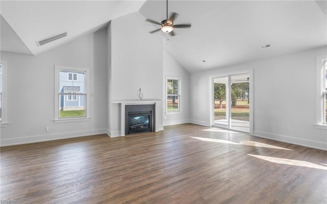 unfurnished living room featuring ceiling fan, dark hardwood / wood-style flooring, and high vaulted ceiling