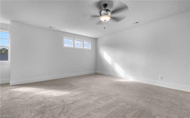 unfurnished room featuring ceiling fan and light colored carpet