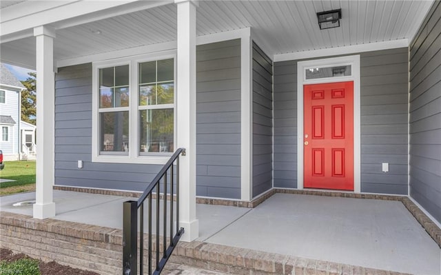 property entrance featuring a porch