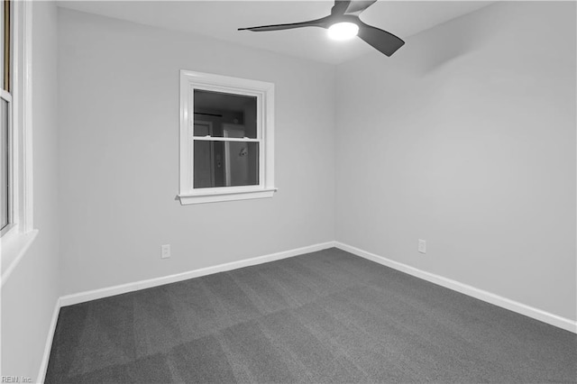 carpeted empty room featuring ceiling fan