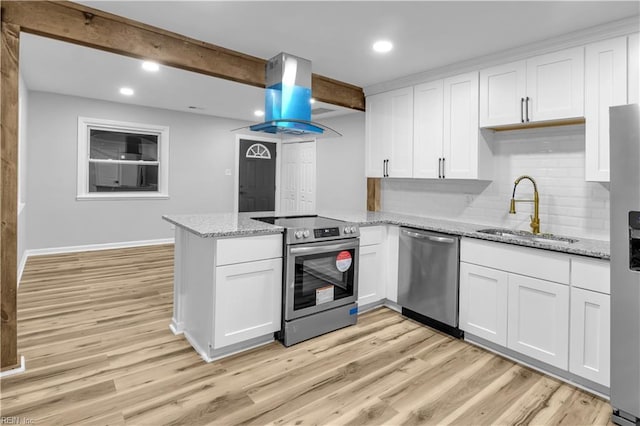 kitchen with island range hood, stainless steel appliances, beam ceiling, white cabinets, and sink