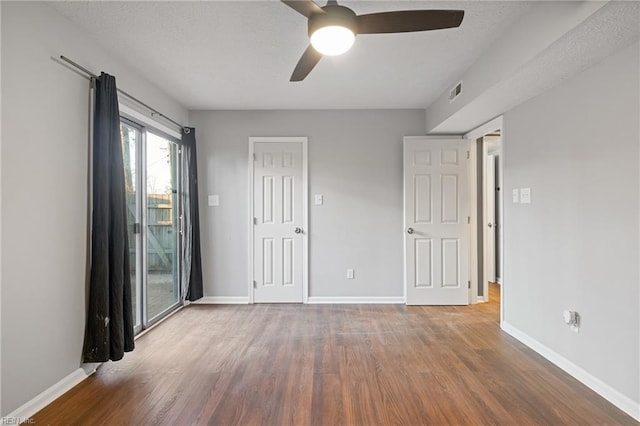 unfurnished room featuring ceiling fan and hardwood / wood-style floors