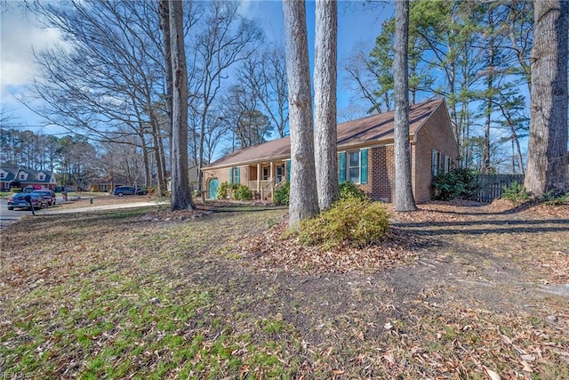 view of side of property with a porch