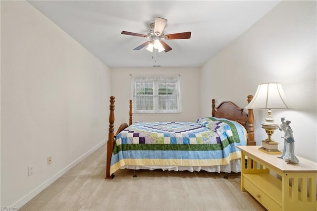 bedroom with ceiling fan and light colored carpet