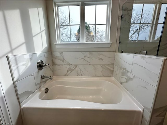 bathroom featuring a washtub